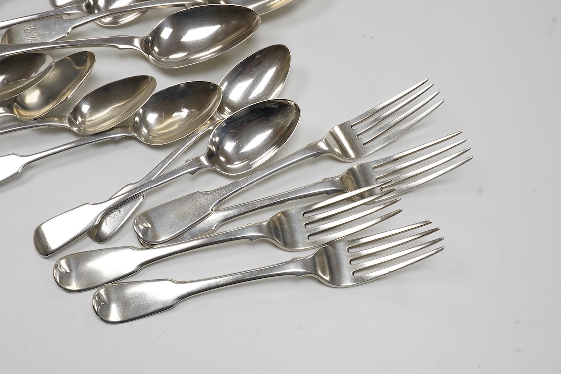 A matched part canteen of 19th century silver fiddle pattern flatware, various dates and makers, including a set of four George III table forks, Eley & Fearn, London, 1807, 28oz, and one plated table spoon.